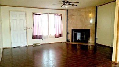 Large living room with wood burning fireplace
