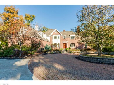 Elegant paver turnaround driveway in front of home