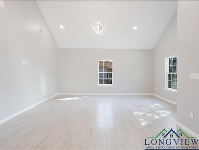 Spare room with high vaulted ceiling, recessed lig