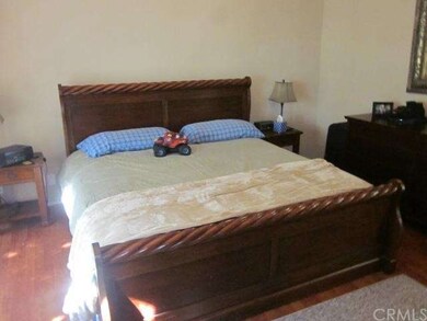 Master bedroom that is spacious with vaulted ceili