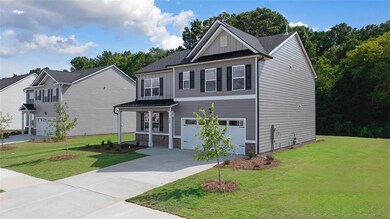 View of front of property with a garage and a fron