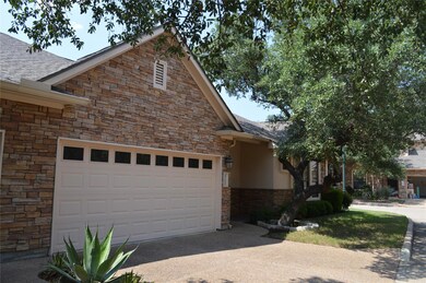 View of front facade featuring stone siding, conc