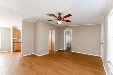 LIVING ROOM WITH NEW CEILING FAN