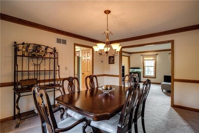 The dining room has crown molding and chair rail.