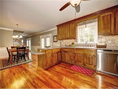 Spacious kitchen with glowing hardwood floor