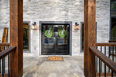 Doorway to property featuring french doors