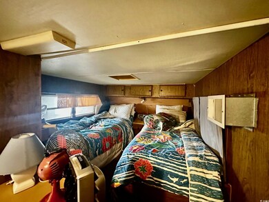 Bedroom featuring wooden walls