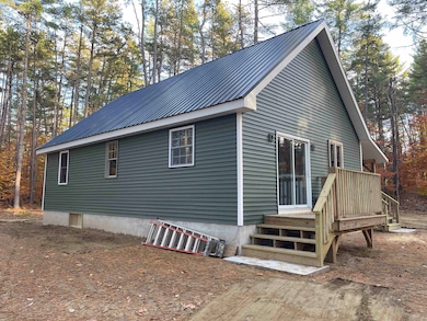 THE DESIGN IS AN APPEALING CAPE STYLE RANCH.