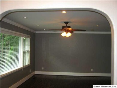 Arched doorway into great room New flooring throug