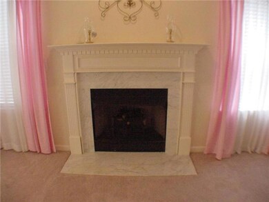 Fireplace with gas logs and electric starter