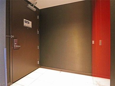 Suite entry foyer with secured owner's storage