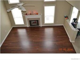 FROM STAIRWAY OVERLOOKING DEN (TO RIGHT KITCHEN)