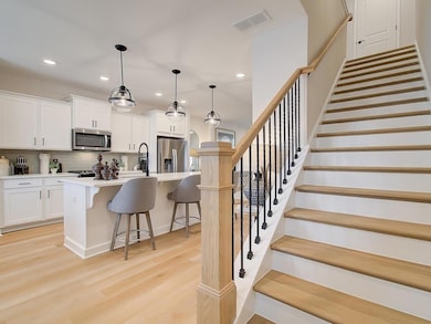 Hardwood treads on both sets of stairs are easy maintenance