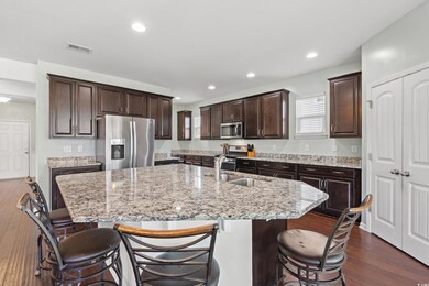 Kitchen featuring sink, dark wood-type flooring, a