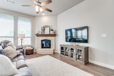 Austin Stone Corner Fireplace & high ceilings, 8 ft. Windows make this home special!