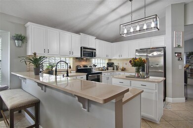 The family chef will fall in love with the updated kitchen, open to a casual dining space and family room, making it easy to entertain friends and gather with family!