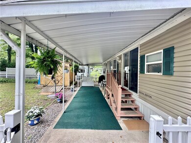Under awning / outside cement pad also fits golf c