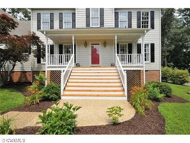 Exterior Front - Beautifully landscaped yard.