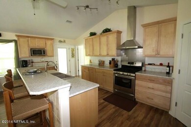 Kitchen with breakfast bar and stainless