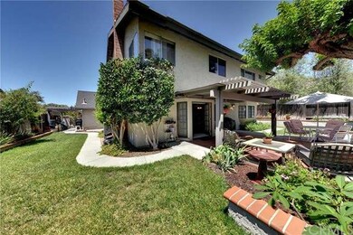 Rear View showing side yard and shady patio...pool