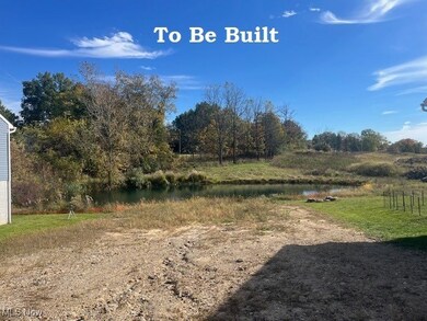 Fantastic setting allows for walk-out lower level and features pond & wooded view.