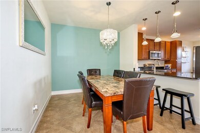 Dining space with baseboards and an inviting chand