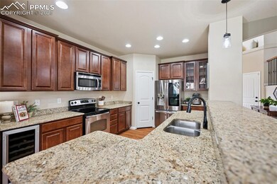 Kitchen with pantry, coffee bar area with glass fr