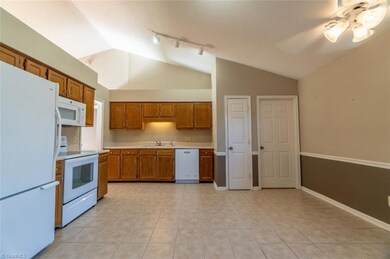 Kitchen with vaulted ceiling.