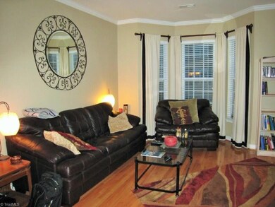 Living Room with Bay Window. Hardwood Floors.