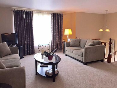 Living Room. Neutral carpet and walls, large front