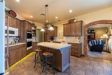 Kitchen with stainless steel double oven, a kitche