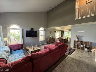Tiled entry way leading into living room featuring