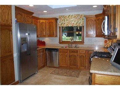 Kitchen. All appliances and window treatments rema