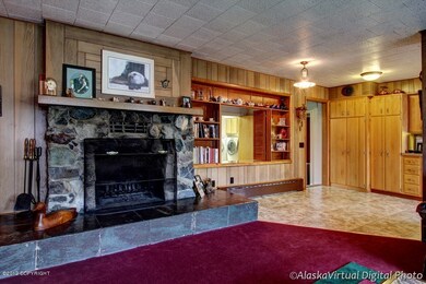 Alaskan-rock wood burning fireplace