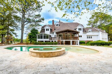 View of swimming pool with a sunroom, a patio, and