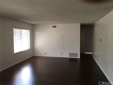 LARGE FAMILY ROOM OFF KITCHEN. NEW LAMINATE FLOORI