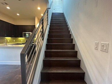 Staircase with visible vents, baseboards, and rec
