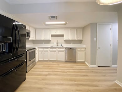 Alternate view of kitchen, pantry door to the righ
