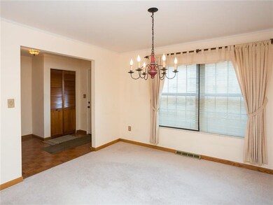 The formal dining room is located just off the foy