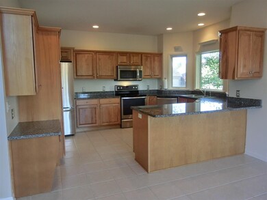 Kitchen with stainless steel appliances, granite c