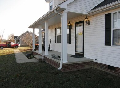 A sidewalk leads from the garage to the front porch for convenience. 