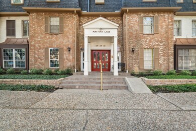 The entrance boasts a stunning brick exterior, cre