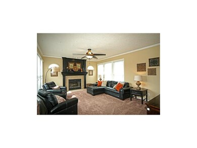 Beautiful floor to ceiling fireplace, walls of win