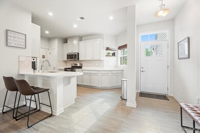 Kitchen with appliances with stainless steel finis