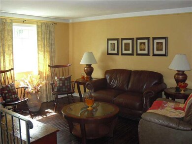 Living Room. The living room is bathed in natural 