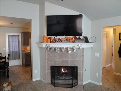 another view of the fireplace and living room