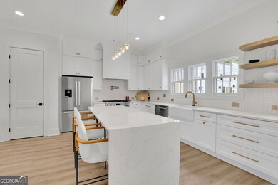 “Photos are of the model home; actual finishes may