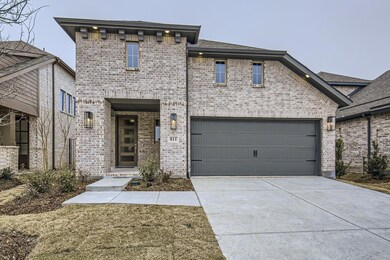 View of front facade featuring a garage