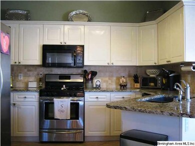 Kitchen with Granite and Tile Backsplash