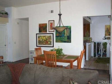 Formal dining area leading to kitchen nook.